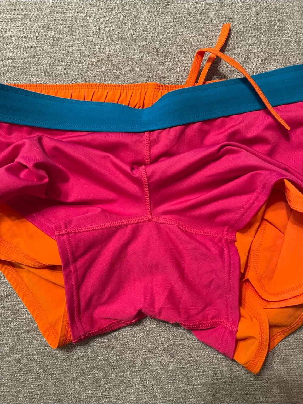 Nike Dri-FIT Women's Bright Orange Running Athletic Shorts with Pink Swoosh